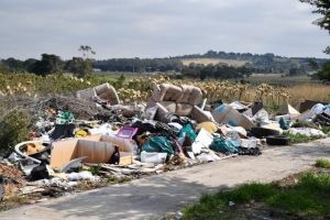 Rubbish mounting outside school