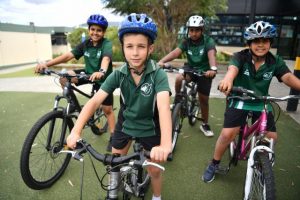 Students get on their bikes