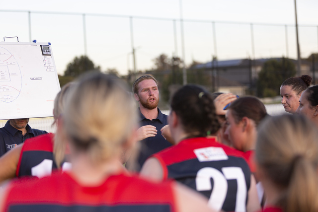 Demons lock in coach