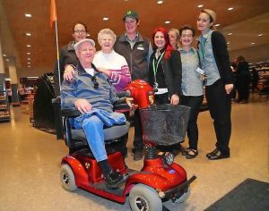 Woolworths Bundoora staff surprise beloved customer Harvey Mynott with motorised scooter