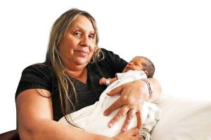 Koori carers cuddling newborns at Northern Hospital